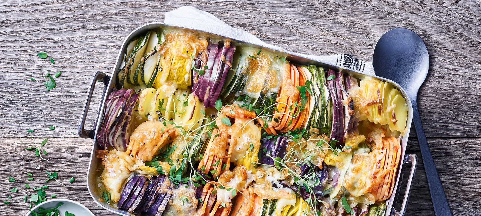 Rezeptbild für Buntes Gemüse-Gratin mit lila Kartoffeln, Zucchini & Süßkartoffeln